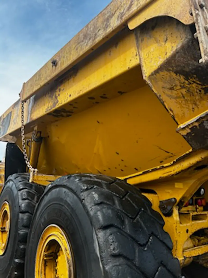 A haul truck in a yard before washing